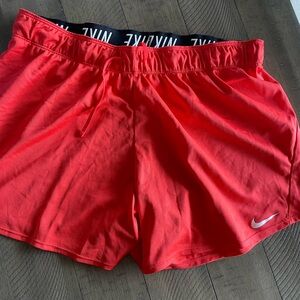 Women’s orange/red active shorts